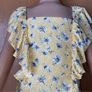 Knit Works yellow eyelet daisy dress with ruffles front, back and hemline. Sweet